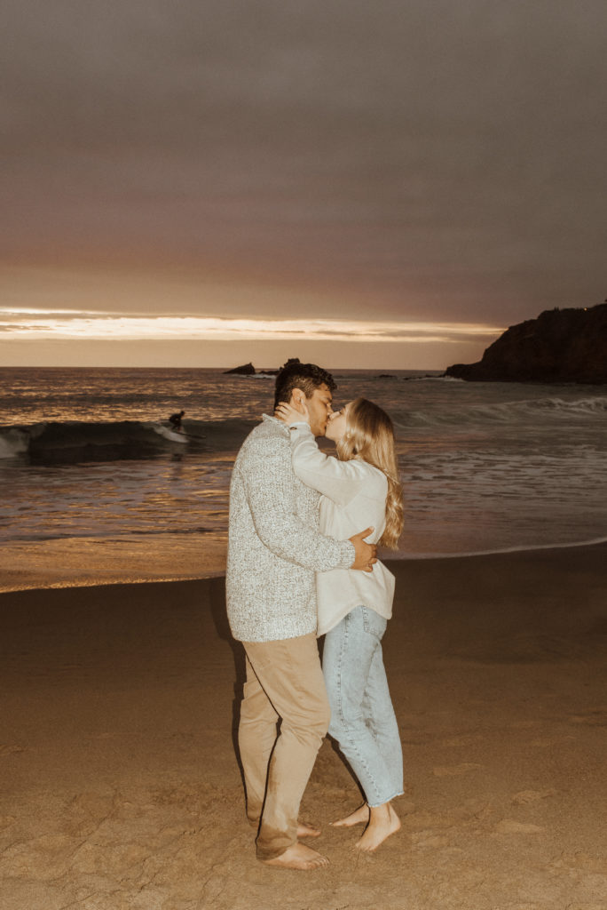 flash photo of an engaged couple at the beach
