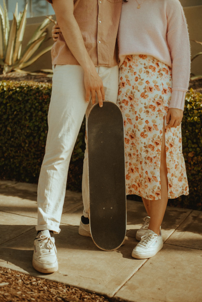 engagement photo couple with skateboard 