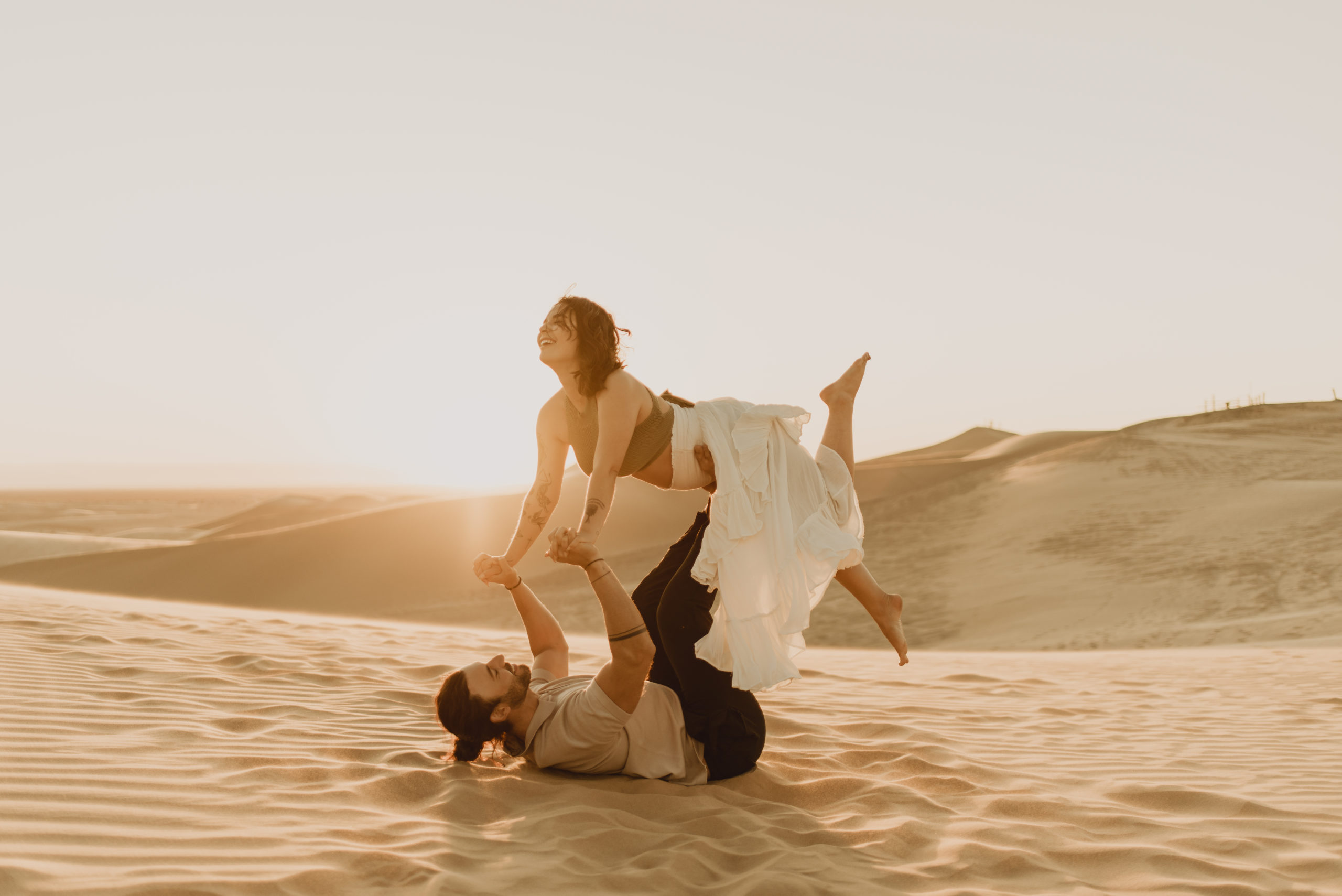 engagement photo of couple at glamis sand dunes